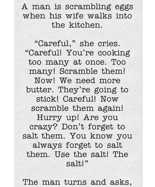 A man is scrambling eggs when his wife walks into the kitchen.