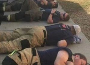 Man snaps heartbreaking photo of firefighters taking a rest after 24 hours of working nonstop